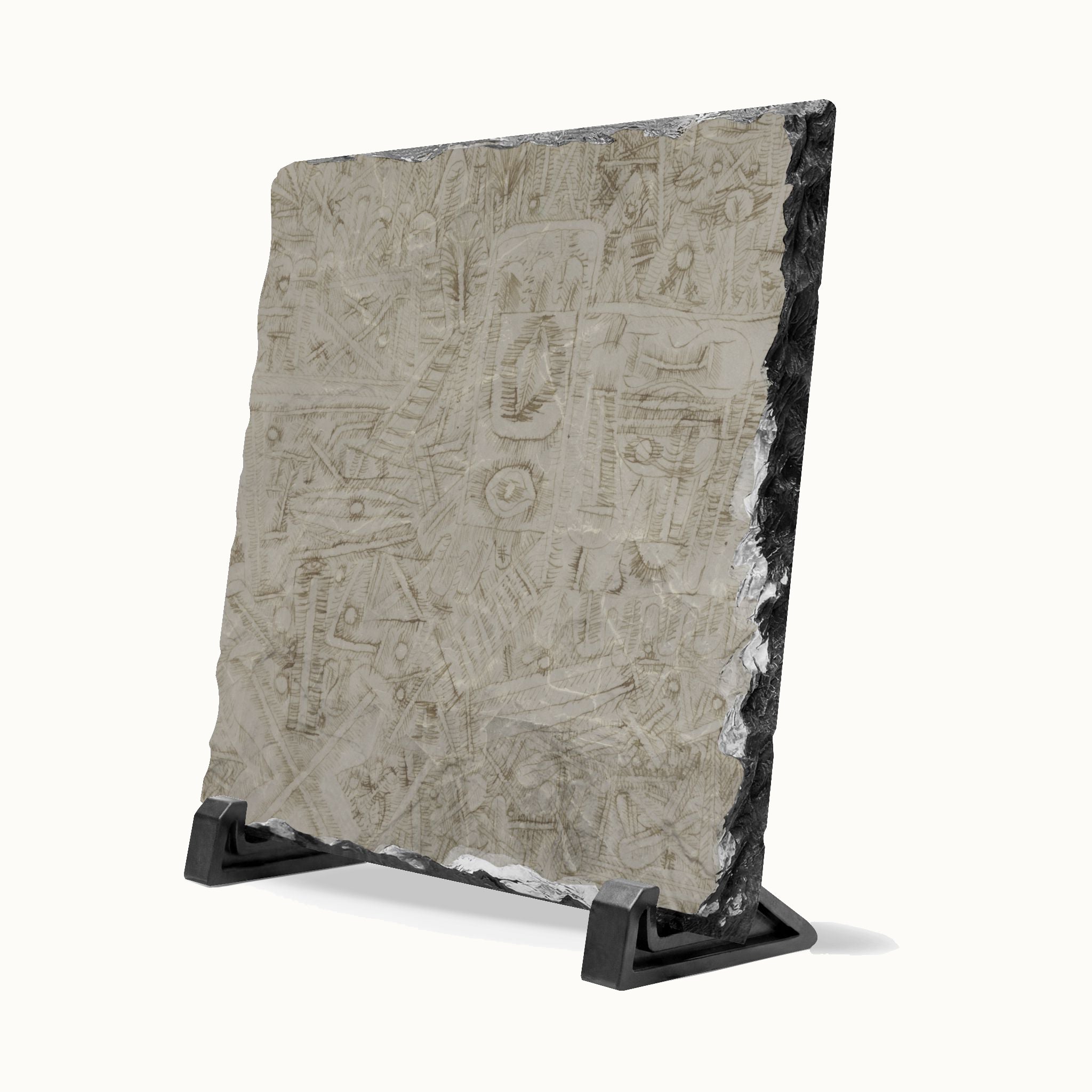 A square stone tile with a textured, etched surface and rough dark edges, displayed on a black metal stand against a white background.