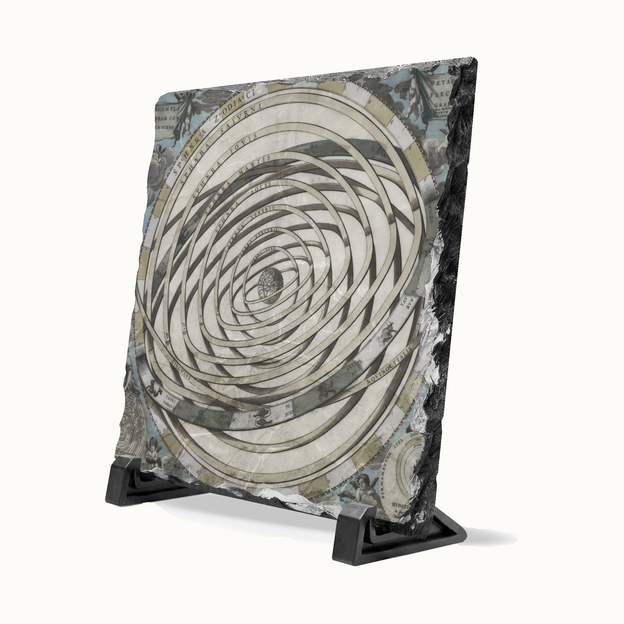 A square decorative plaque or tile with a spiral optical illusion design in beige, gray, black, and muted blue tones, displayed on a black stand against a light off-white background.