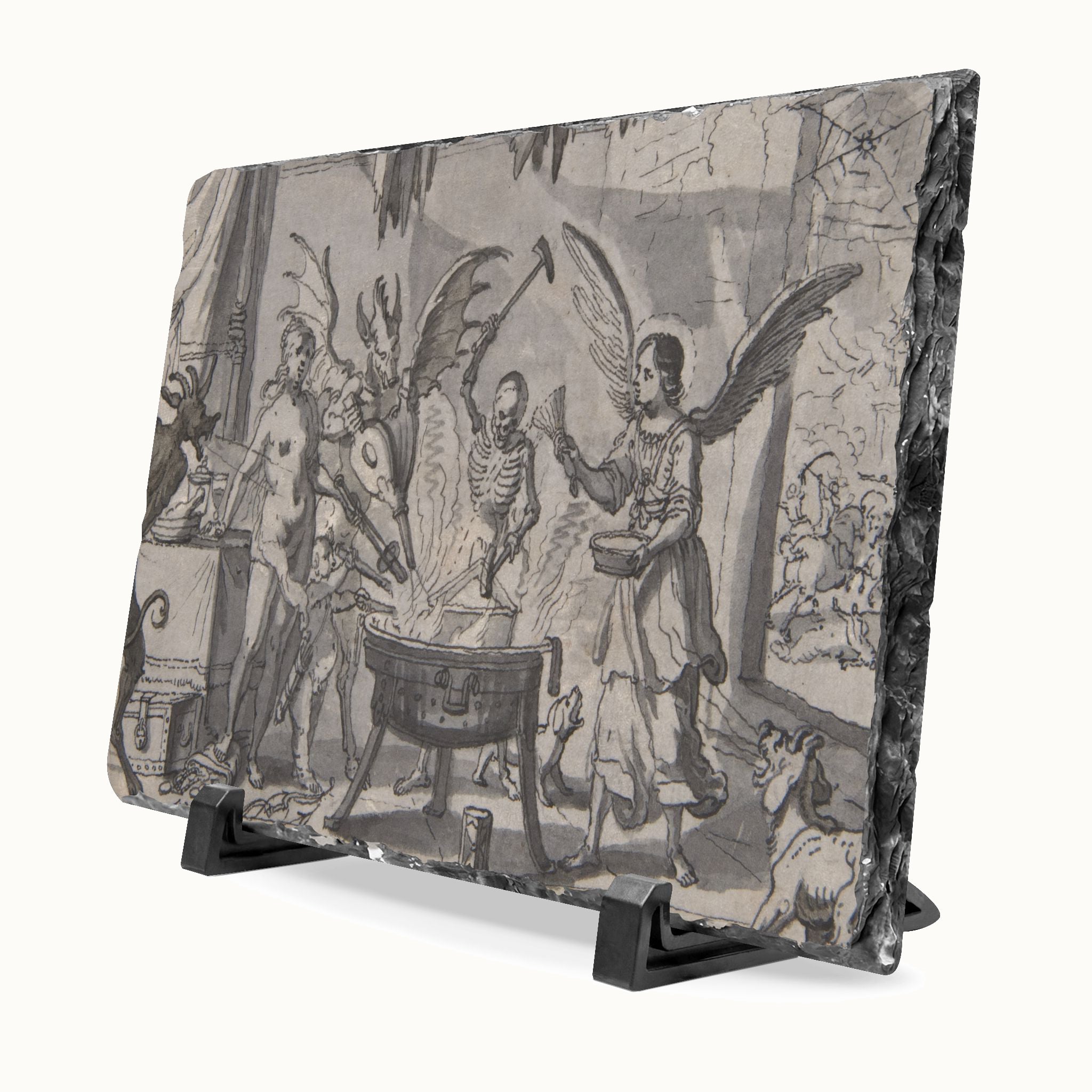 A rectangular slate art plaque featuring a monochrome gothic illustration of a scene with angels, skeletal figures, and a cauldron, displayed on a black stand against a white background.