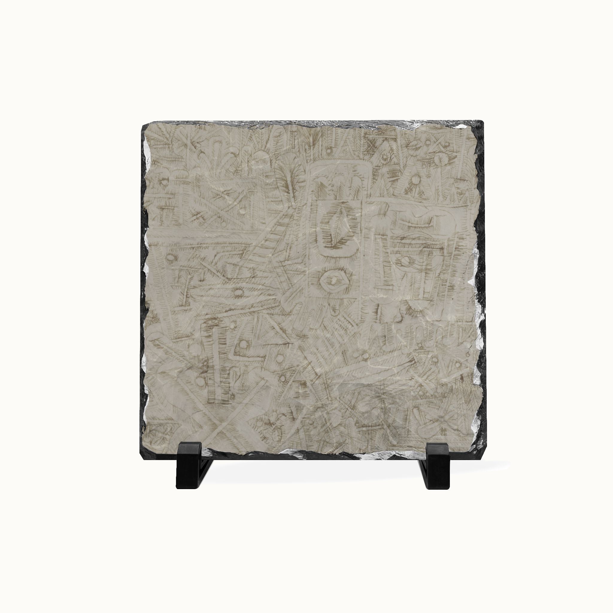 A square slate art plaque featuring an intricate, hand-carved Mayan-style calendar design, displayed on a small black stand against a white background.