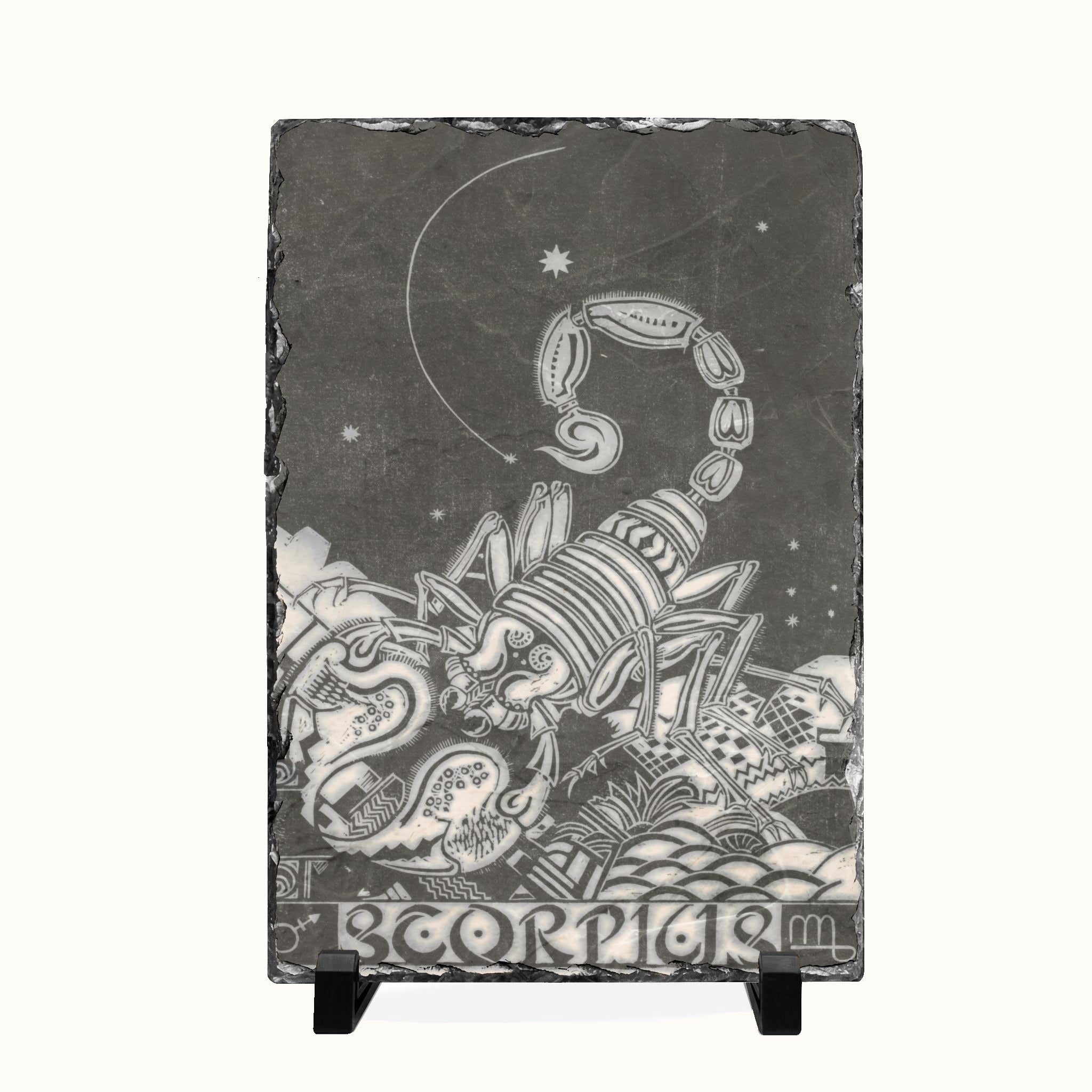 A rectangular slate sign featuring a detailed black and white illustration of a Scorpion zodiac sign, displayed on a small black stand against a light background.